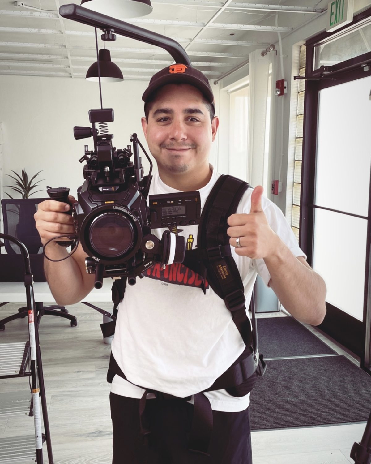 Matt Chavez on set, operating a cinema camera rig