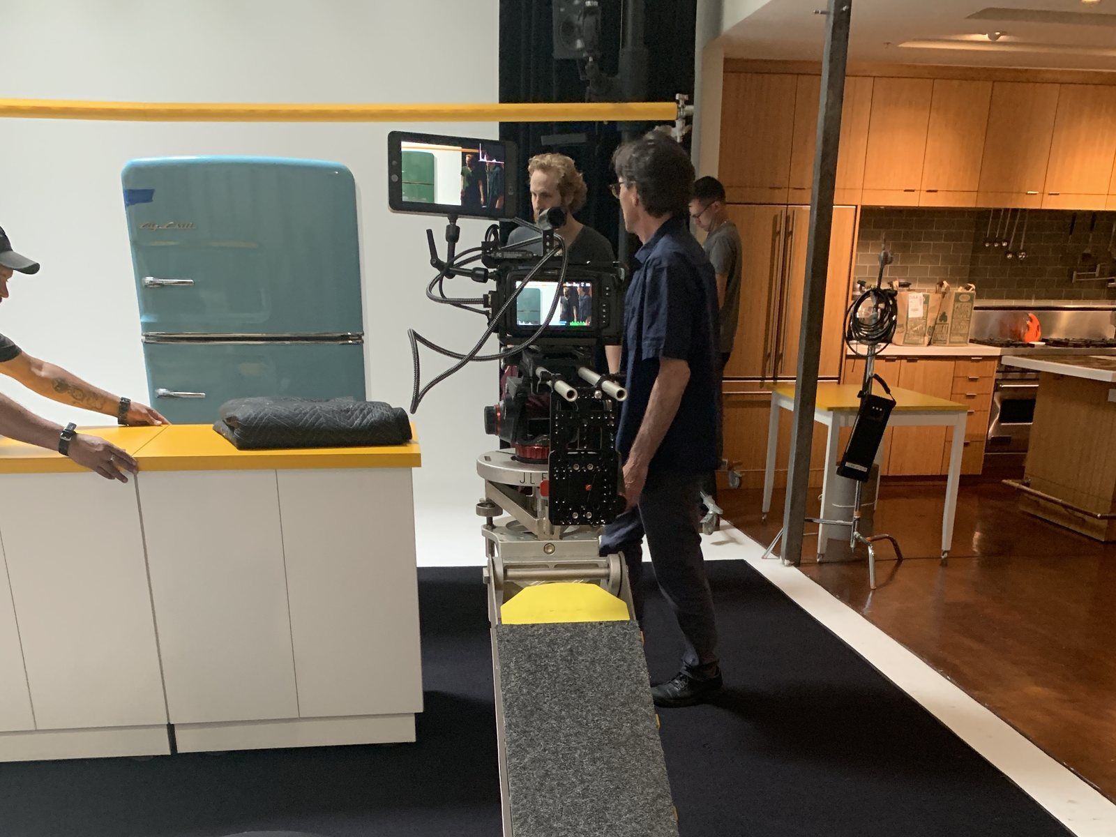 The kitchen set built on the cyc at The Producer's Loft Studio, dolly track in the foreground